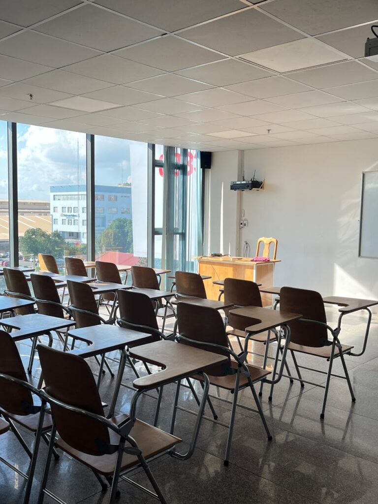 empty classroom with sunlight streaming through windows