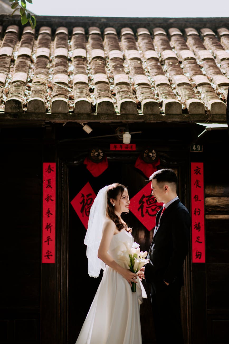 a couple wearing wedding attire