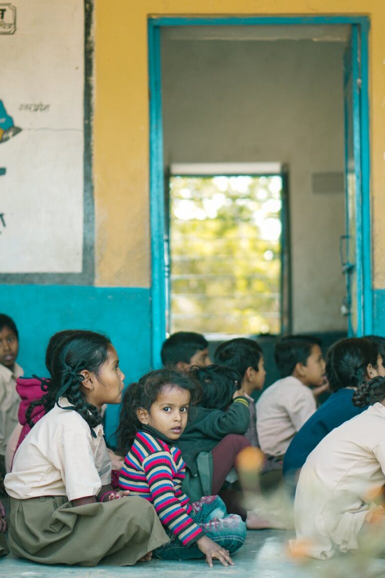 group of listening little children sitting on the floor
