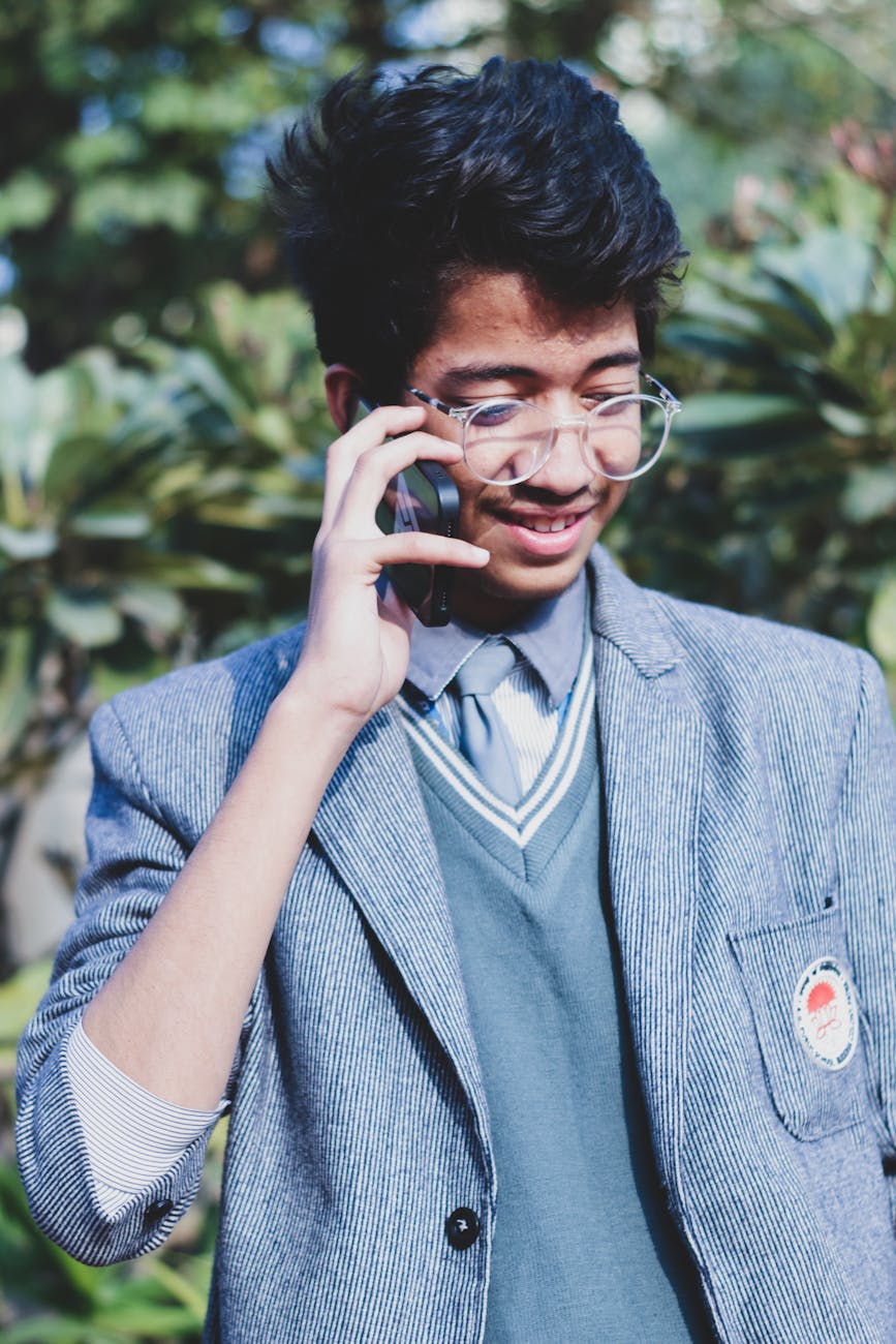 young man talking on a phone and smiling