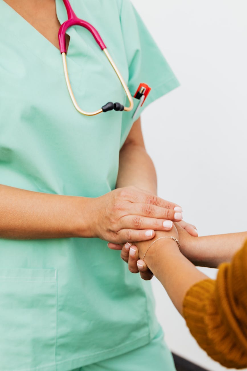 a nurse and patient doing handshake