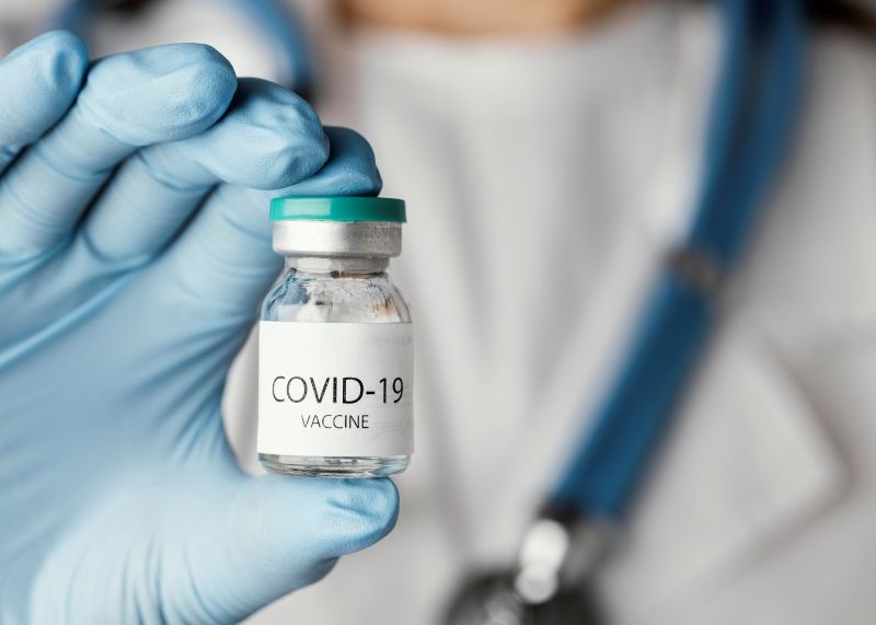 doctor preparing covid 19 vaccine